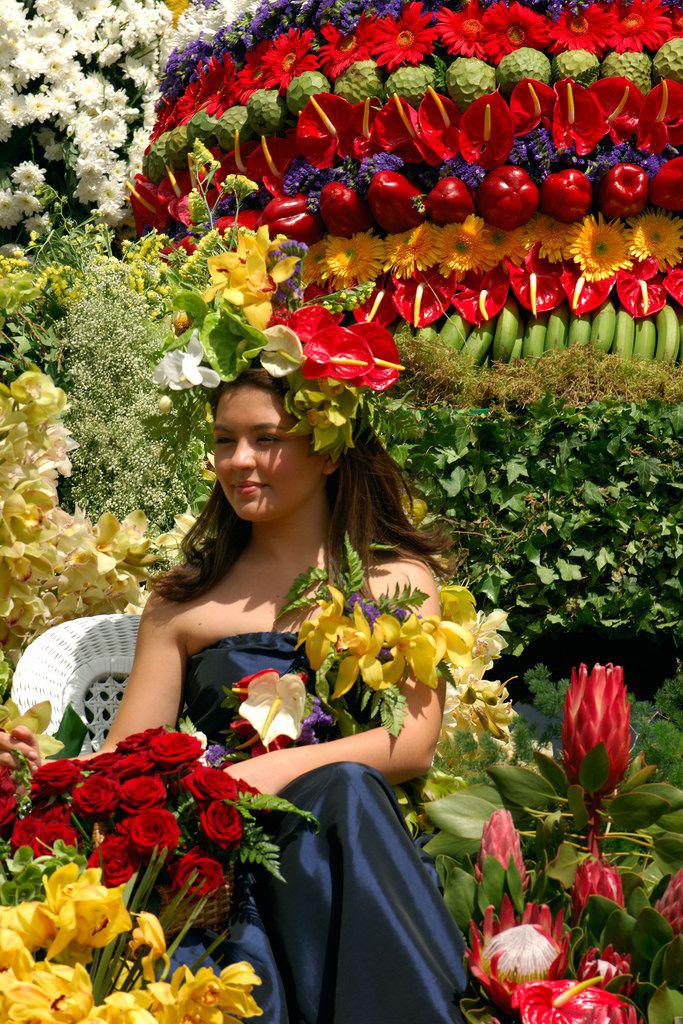 A woman surrounded by fresh flowers
